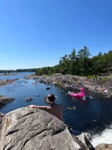 Man looking from above waterfall