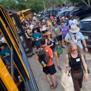 People outside buses