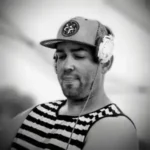 Man with cap and headphones on