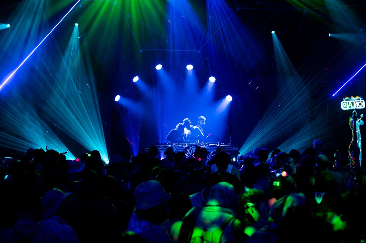 Blue lit stage with DJs