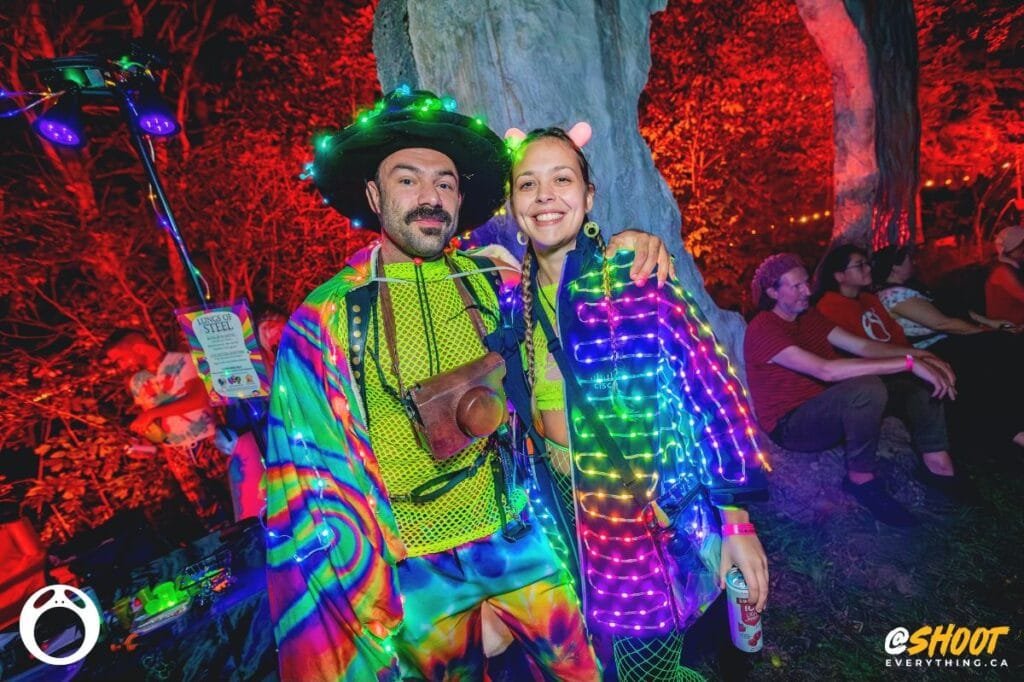 A couple with colourful lit clothing