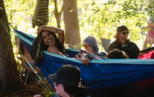 A woman smiling in a hammock