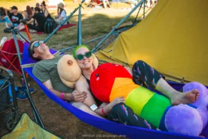 Couple resting with fun boob and penis pillows