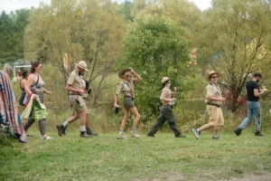 A line of park rangers walking by