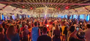 Large dancing crowd in ballroom