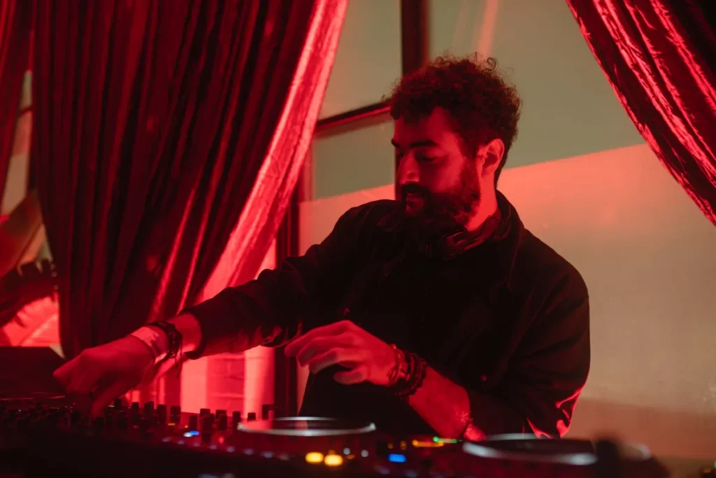 DJ with beard lit red