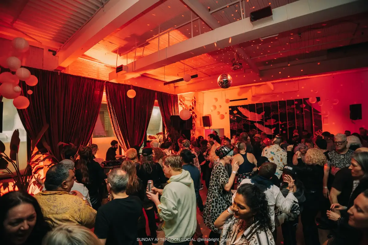 Dancers in red lit room