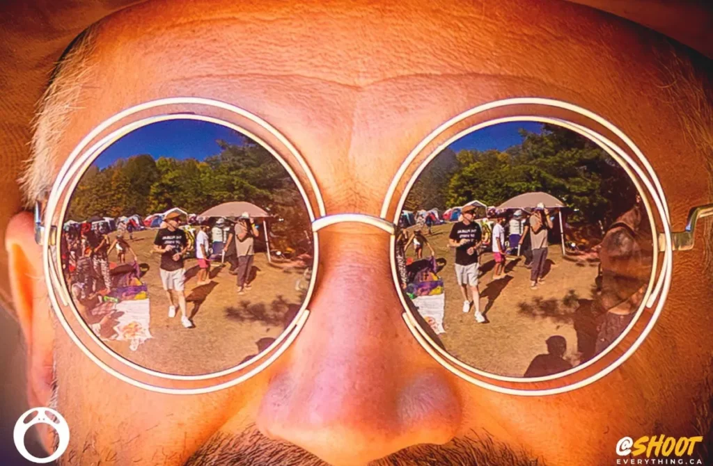 Close up of face with stache and sunglass reflection of path
