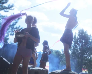 People on rocks in day by fite