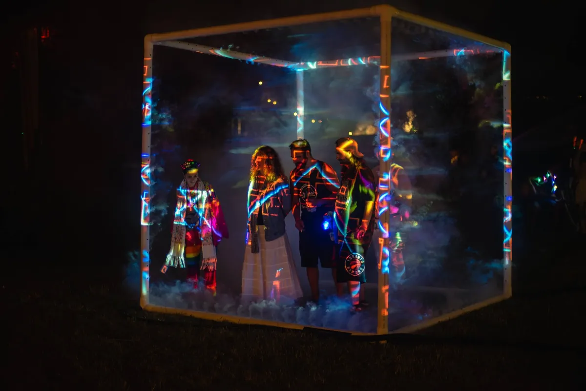 A misty cube with people