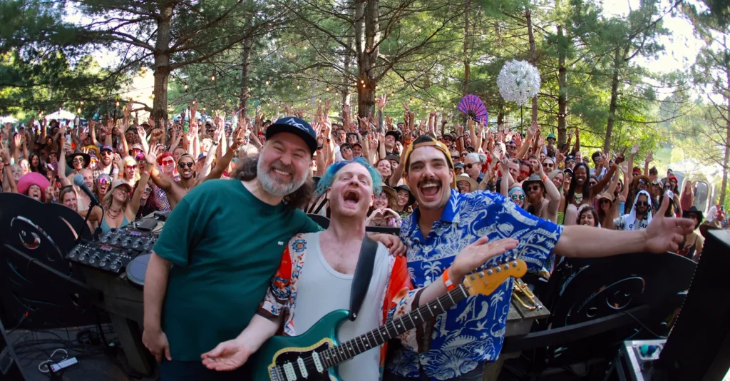 Harvest Festival 2026: Band members with excited crowd at outdoor concert