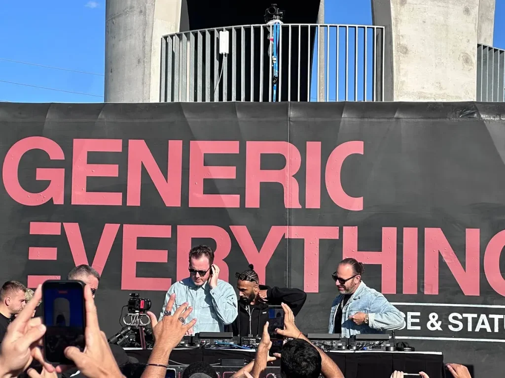 Chase & Status DJs performing at a pop-up event with "GENERIC EVERYTHING" banner