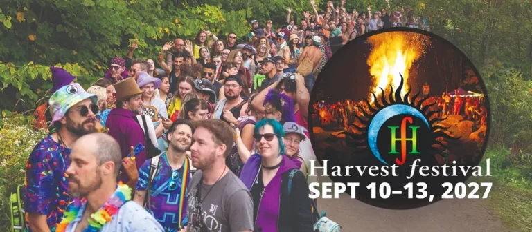 A lineup of people outdoors on a path with Harvest Festival 2027 as a title
