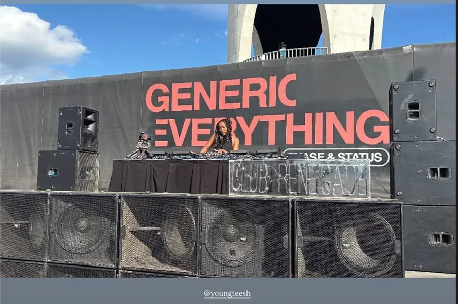 DJ at Chase & Status event with "GENERIC EVERYTHING" banner
